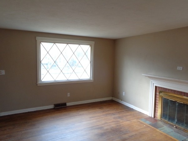 34 Mark Street Springfield, MA 01129 - Photo 6 of 15 an empty room with wooden floor and windows