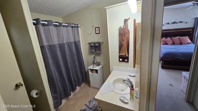 a bathroom with a tub and shower