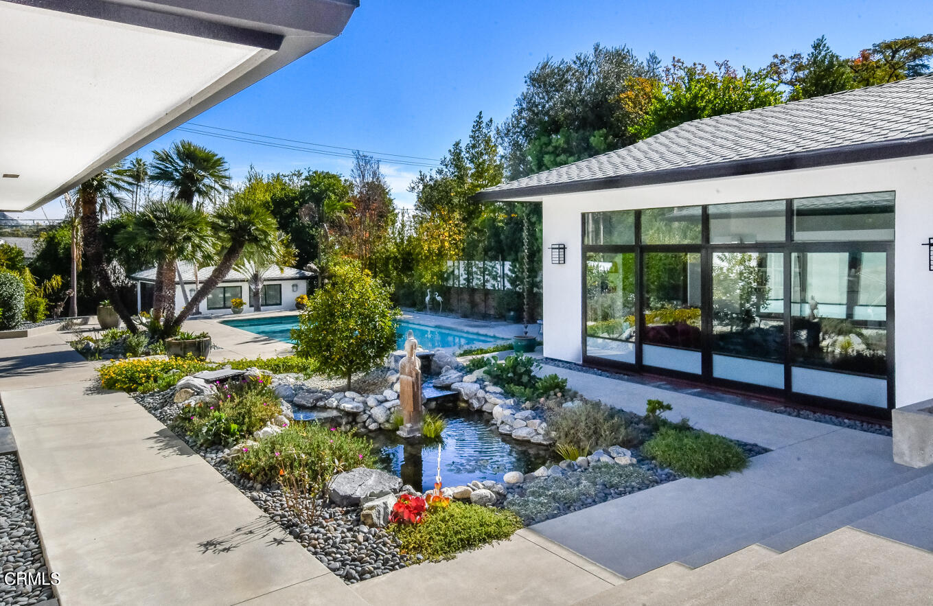 a front view of a house with garden