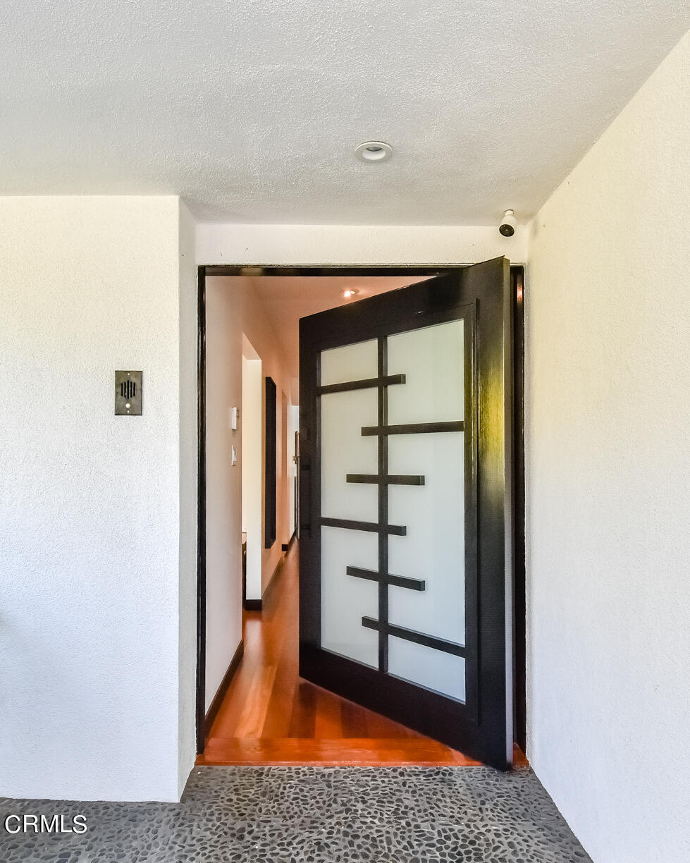 2174 Midlothian Drive Altadena, CA 91001 - Photo 2 of 54 a view of a hallway with wooden floor and door