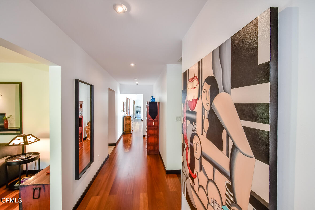 2174 Midlothian Drive Altadena, CA 91001 - Photo 21 of 54 a view of a hallway with wooden floor and stairs