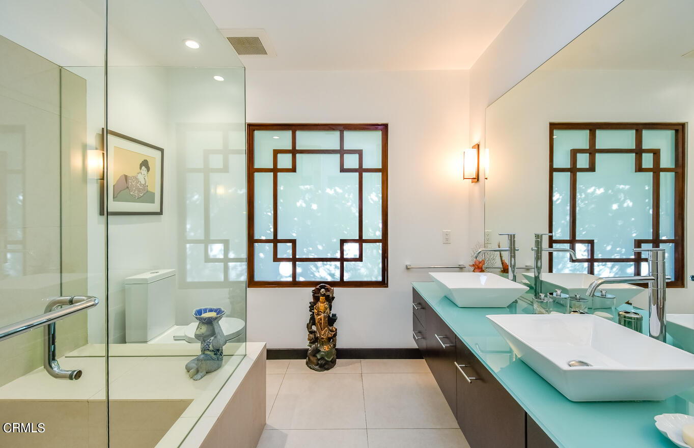 2174 Midlothian Drive Altadena, CA 91001 - Photo 24 of 54 a room with a large bed and a large window