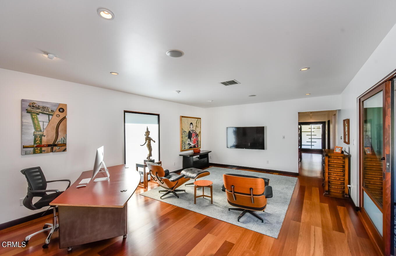 2174 Midlothian Drive Altadena, CA 91001 - Photo 26 of 54 a living room with furniture and a flat screen tv