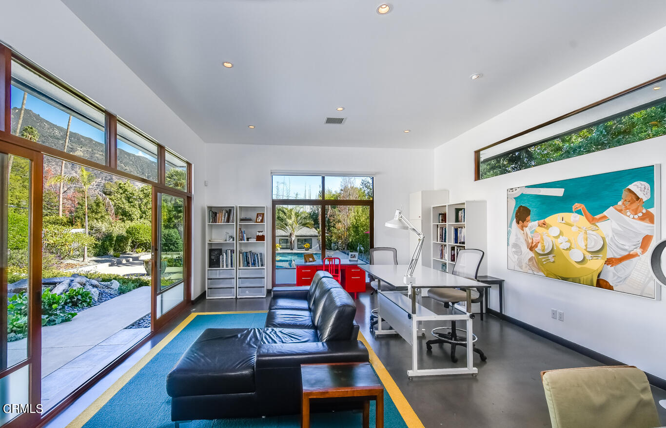 2174 Midlothian Drive Altadena, CA 91001 - Photo 28 of 54 a living room with furniture floor to ceiling window and wooden floor