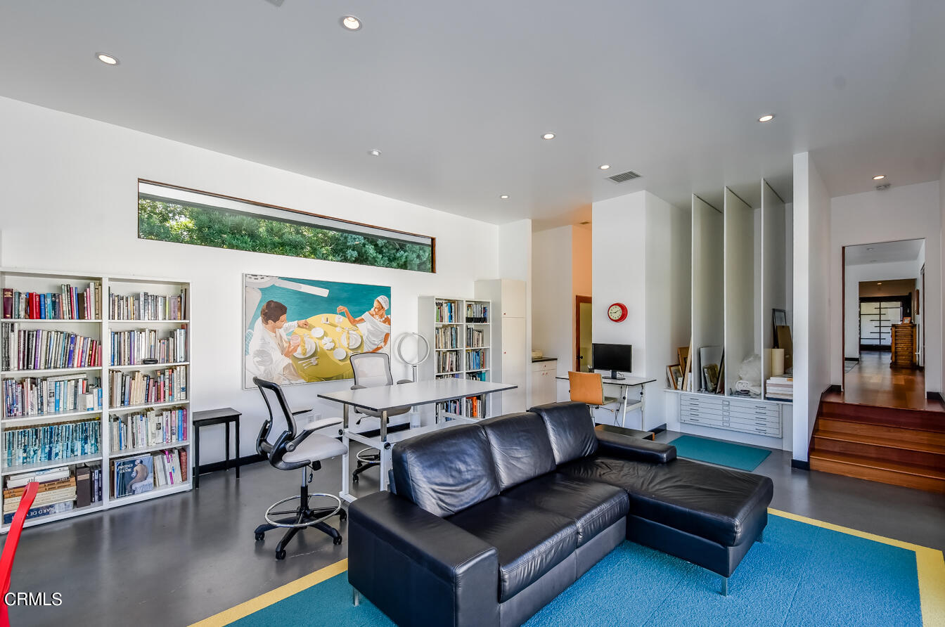 2174 Midlothian Drive Altadena, CA 91001 - Photo 29 of 54 a living room with furniture and a book shelf