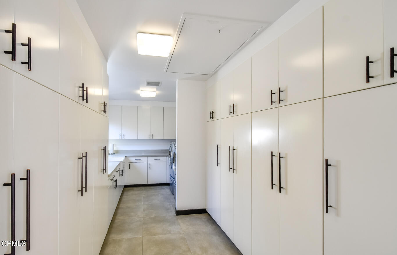 2174 Midlothian Drive Altadena, CA 91001 - Photo 32 of 54 a bathroom with a glass shower door and a sink