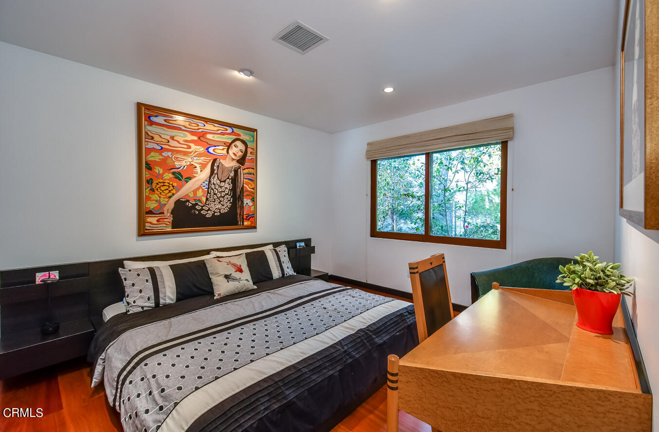 2174 Midlothian Drive Altadena, CA 91001 - Photo 36 of 54 a bedroom with furniture and a window