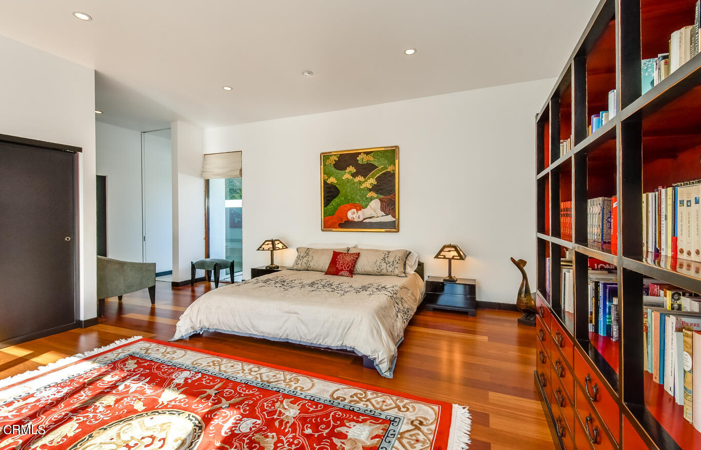2174 Midlothian Drive Altadena, CA 91001 - Photo 37 of 54 a bedroom with a bed and a book shelf