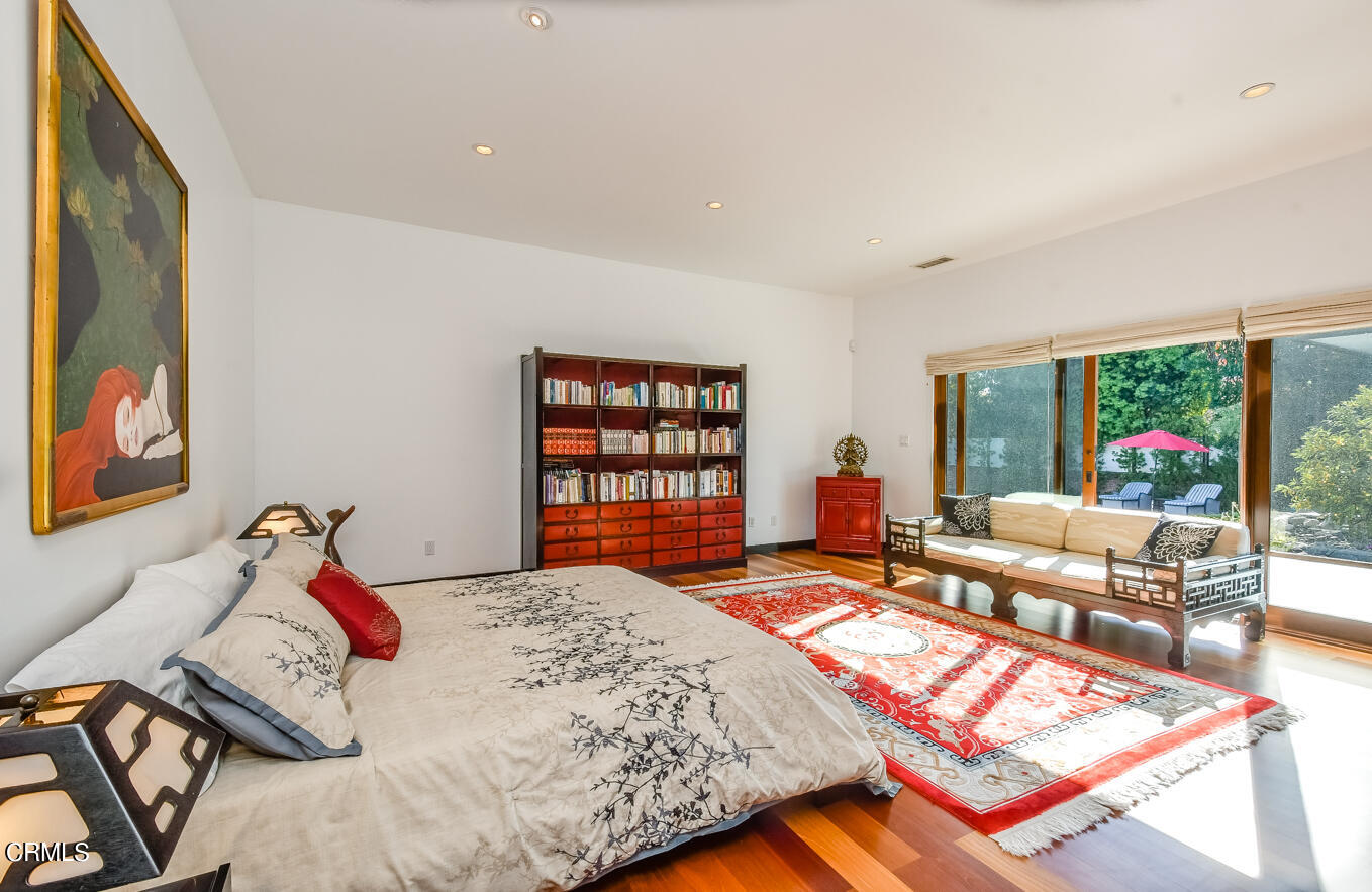 2174 Midlothian Drive Altadena, CA 91001 - Photo 38 of 54 a bedroom with a bed and a large window
