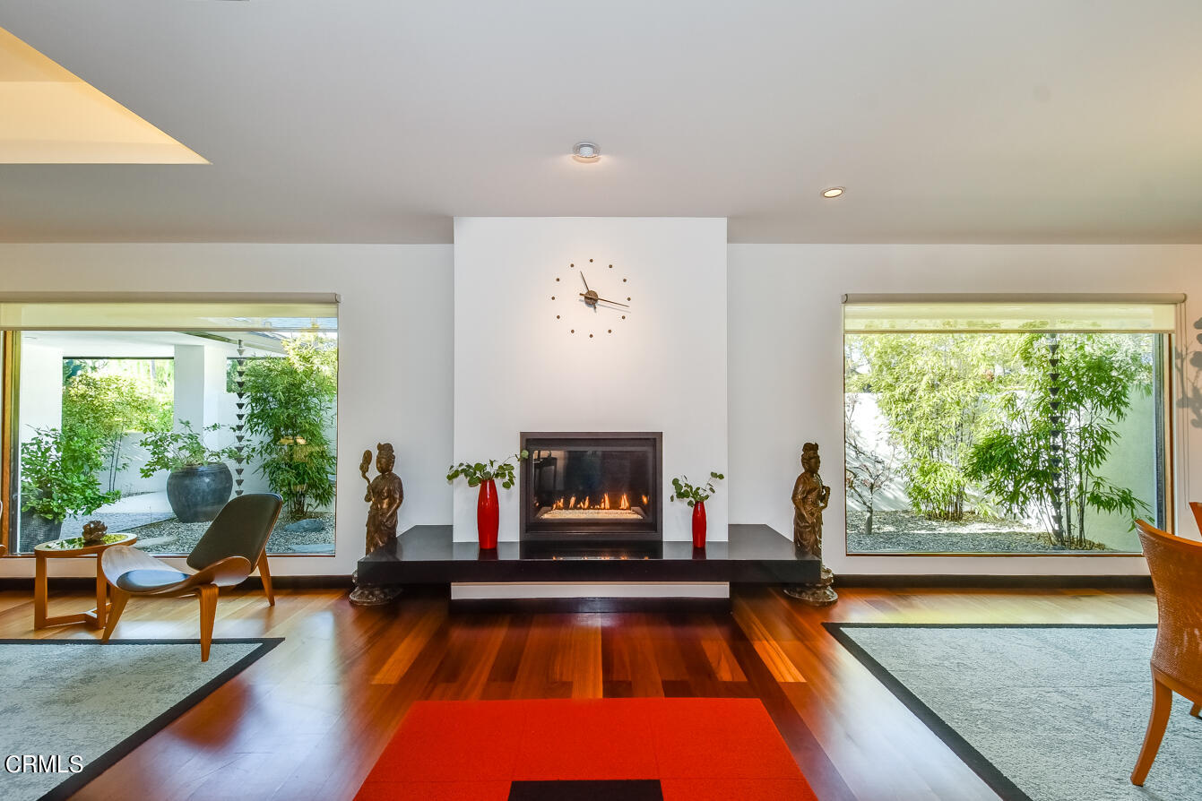2174 Midlothian Drive Altadena, CA 91001 - Photo 6 of 54 a living room with fireplace furniture and a large window