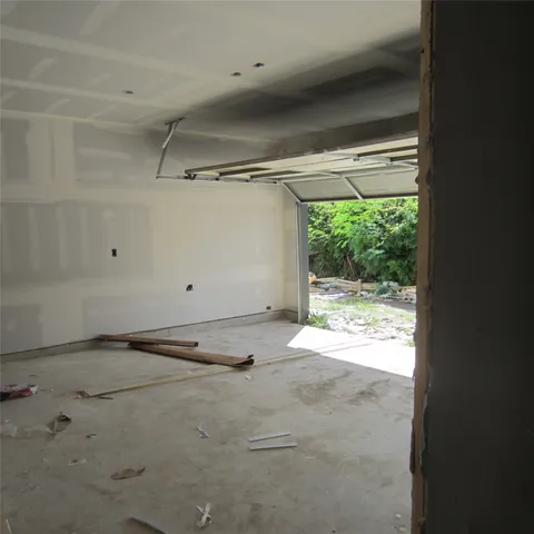 a view of a room with rack on the wall and a window