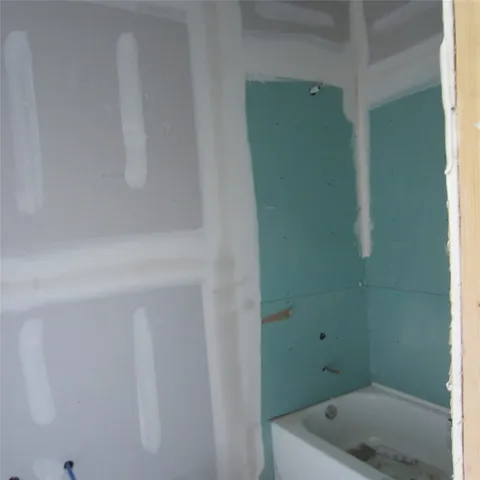 a bathroom with a sink and shower