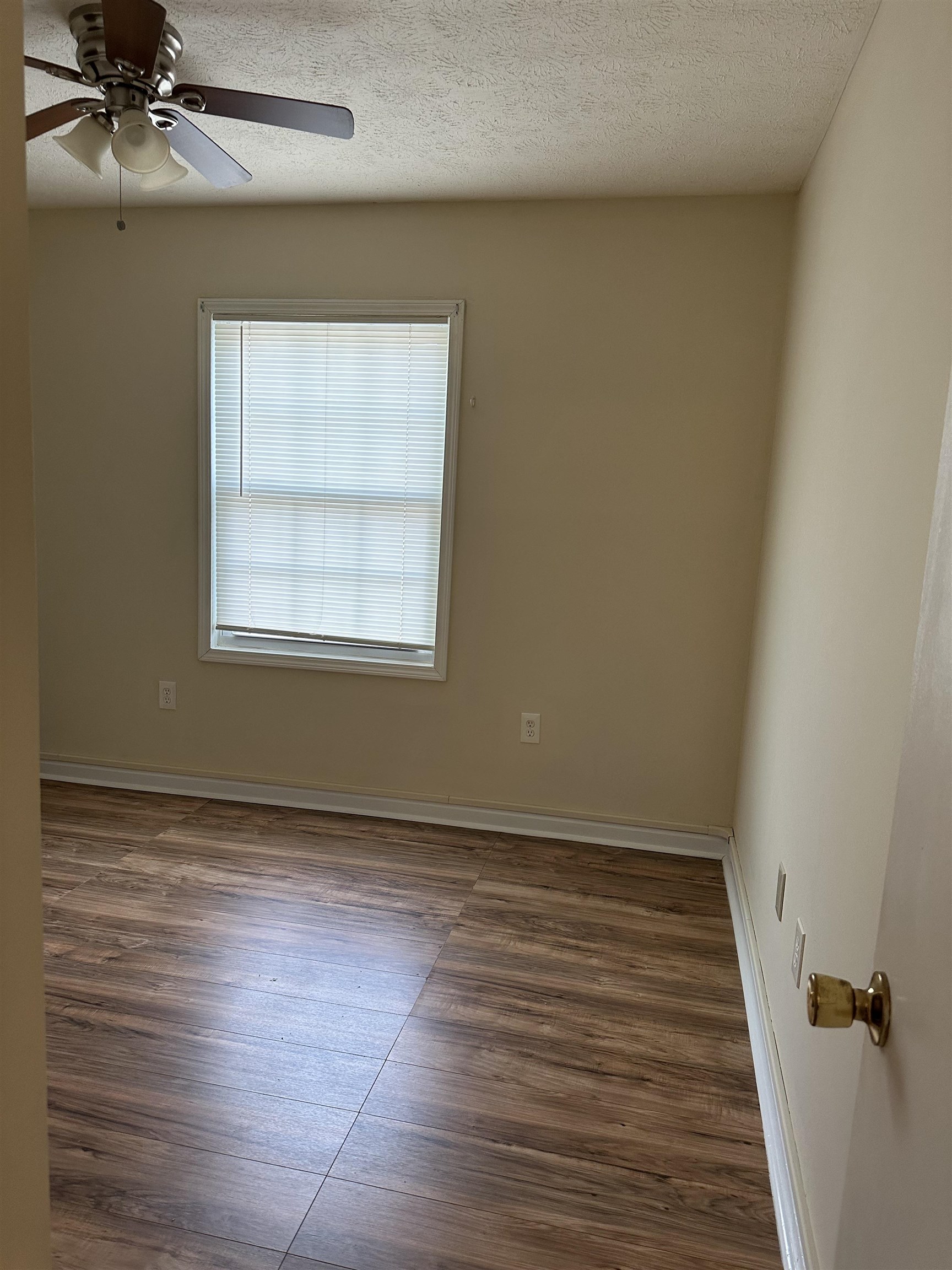 420 Pine Avenue Murrells Inlet, SC 29576 - Photo 14 of 21 Unfurnished room featuring wood finished floors, a textured ceiling, and ceiling fan