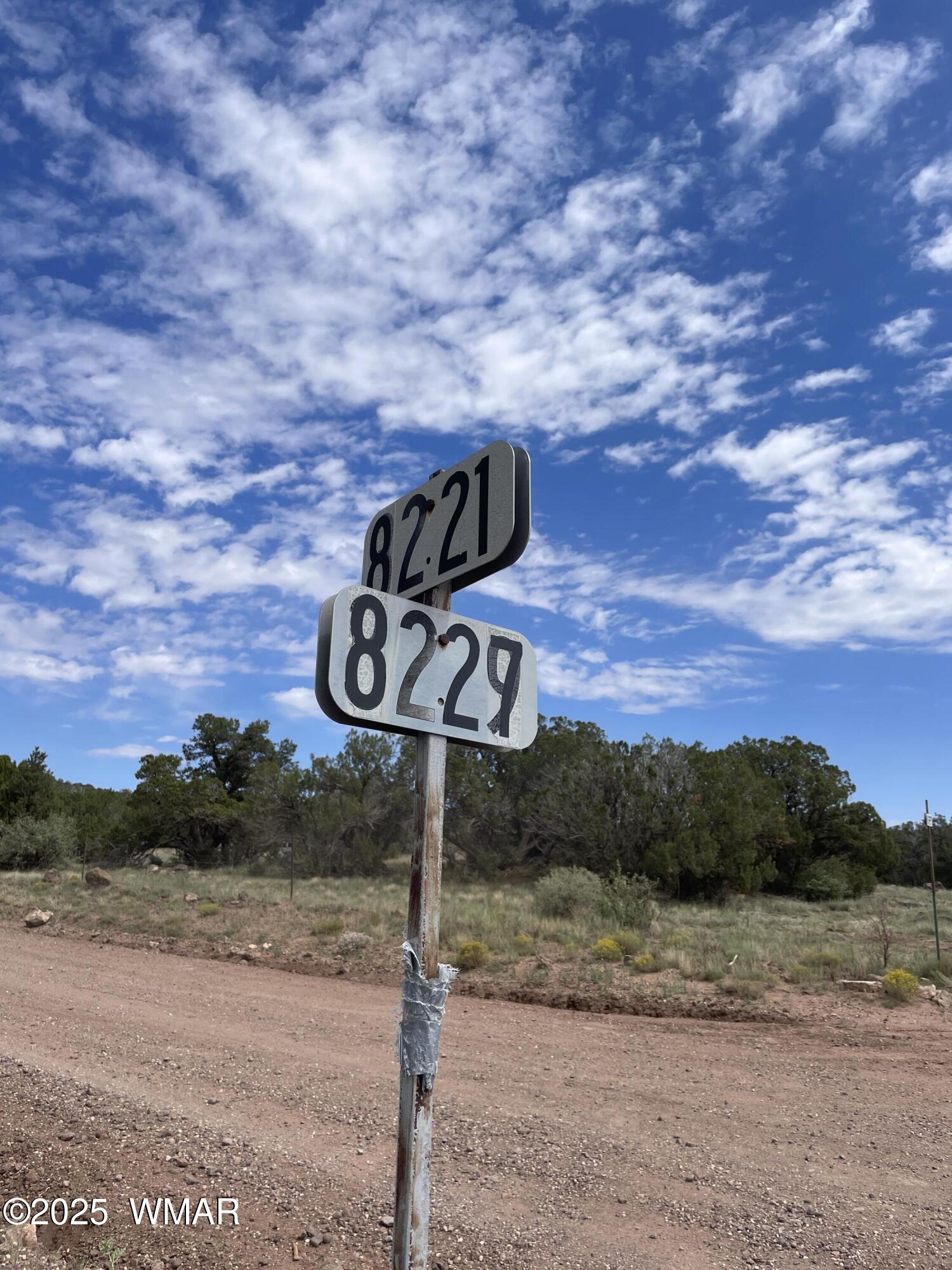 35 Burns Road Concho, AZ 85924 - Photo 8 of 11 a street sign sitting on top of a road