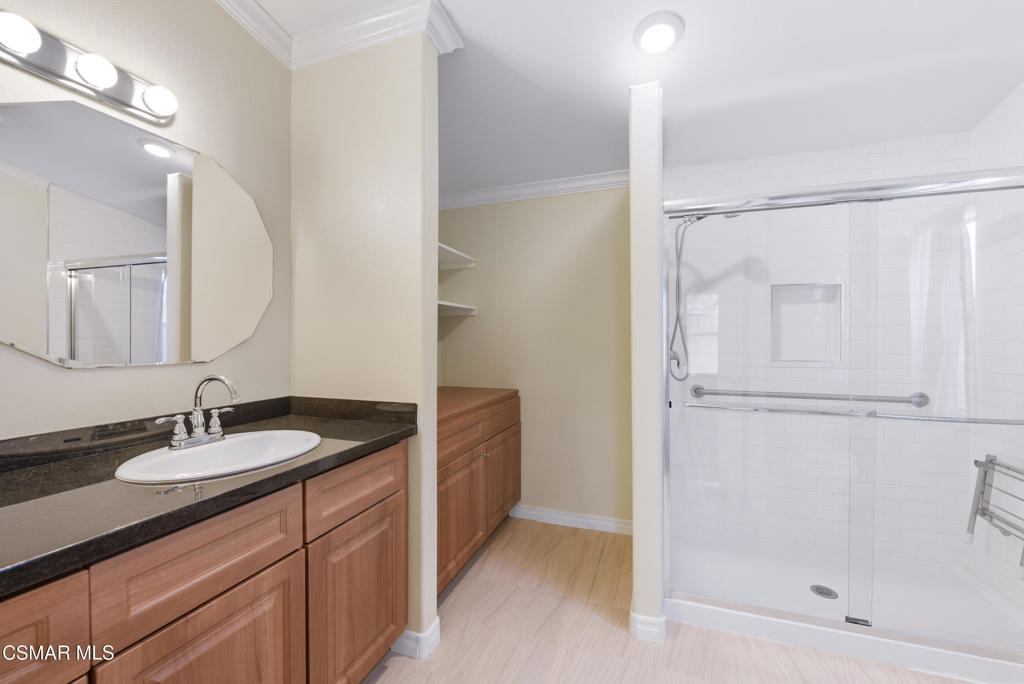 89 Via Gabilan Camarillo, CA 93012 - Photo 20 of 34 a bathroom with a granite countertop sink mirror and a bathtub