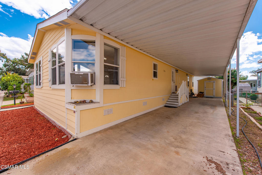 89 Via Gabilan Camarillo, CA 93012 - Photo 22 of 34 a view of a house with backyard and parking
