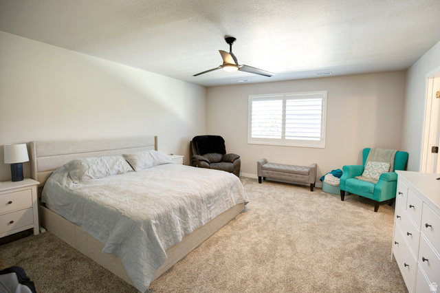 983 South 950 West Provo, UT 84601 - Photo 15 of 56 Spacious room featuring neutral carpeting, a ceiling fan with integrated lighting, and a window equipped with white plantation shutters