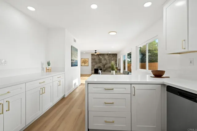 a kitchen with sink cabinets and window