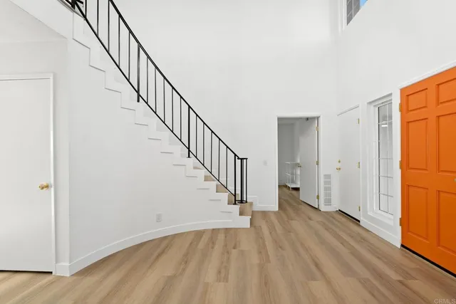 a view of entryway with wooden floor