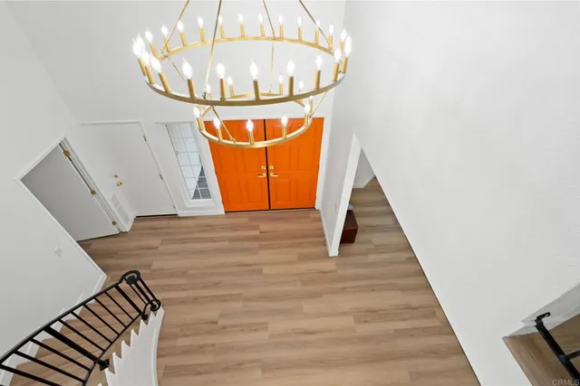 a bedroom with a large bed and a large window