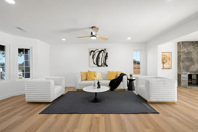 a view of living room filled with furniture and window