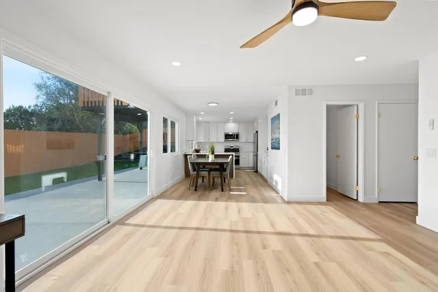 a view of a lobby with chair and a floor to ceiling window