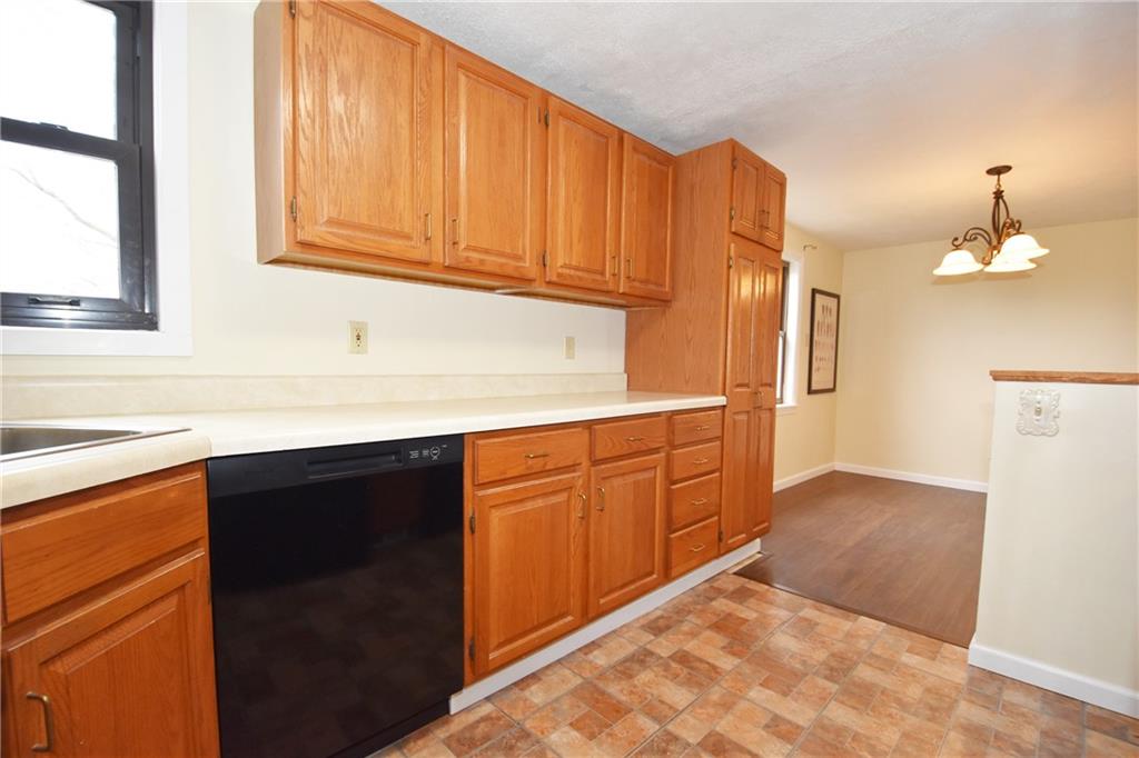721 Highview Road Pittsburgh, PA 15234 - Photo 11 of 23 a kitchen with stainless steel appliances granite countertop a sink and a cabinets