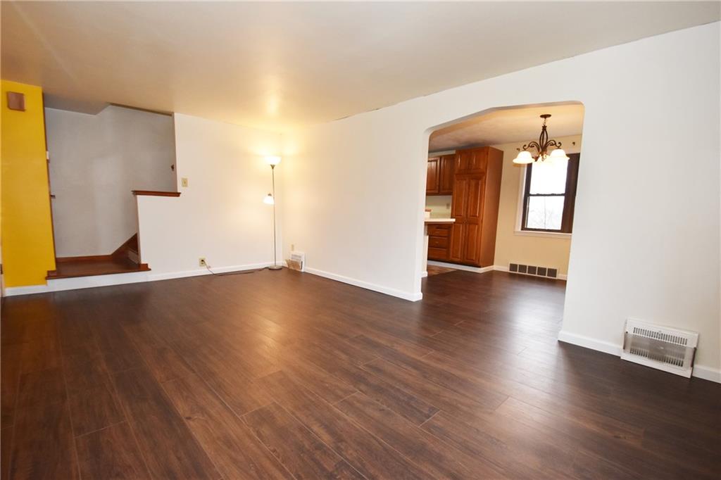 721 Highview Road Pittsburgh, PA 15234 - Photo 5 of 23 an empty room with wooden floor and windows