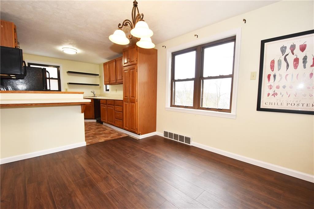 721 Highview Road Pittsburgh, PA 15234 - Photo 8 of 23 a view of a kitchen with a sink wooden cabinets and stainless steel appliances