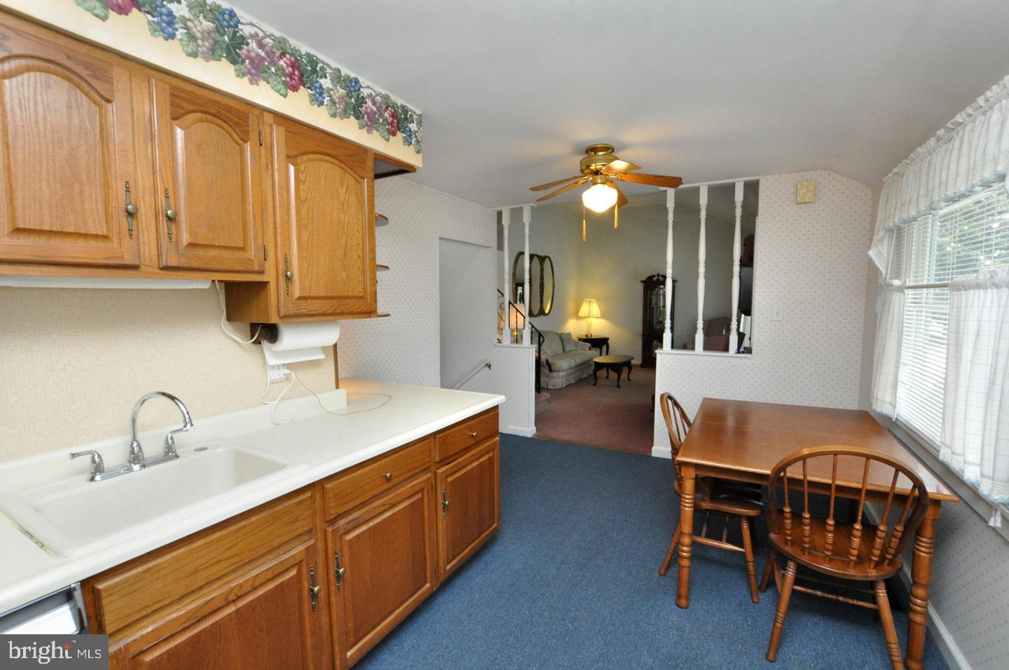 811 Fordham Street Delran, NJ 08075 - Photo 5 of 20 a kitchen with a sink cabinets and dining table