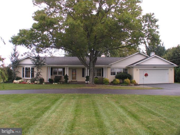17019 West Willard Road Poolesville, MD 20837 - Photo 1 of 24 a front view of a house with a yard
