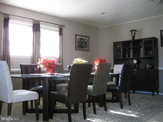 17019 West Willard Road Poolesville, MD 20837 - Photo 12 of 24 a dining room with furniture and window