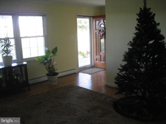 17019 West Willard Road Poolesville, MD 20837 - Photo 17 of 24 a living room with furniture window and wooden floor