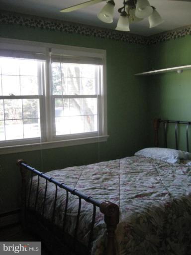 17019 West Willard Road Poolesville, MD 20837 - Photo 19 of 24 a bedroom with a bed and window