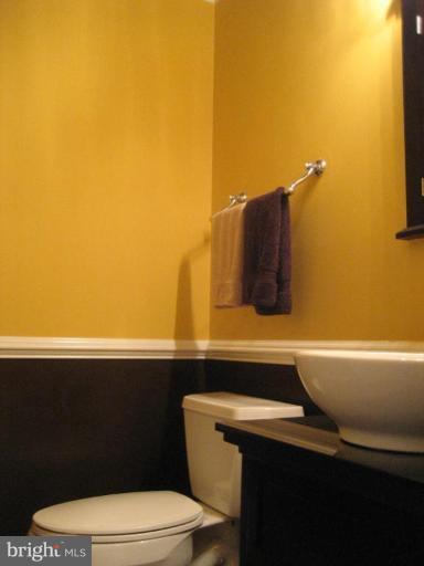 17019 West Willard Road Poolesville, MD 20837 - Photo 22 of 24 a bathroom with a sink a toilet and mirror