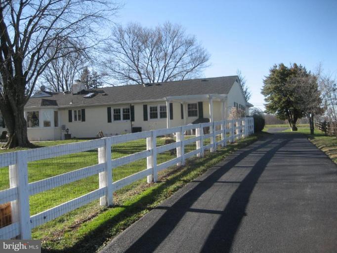 17019 West Willard Road Poolesville, MD 20837 - Photo 24 of 24 a front view of a house with a yard