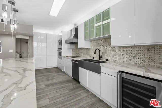 a kitchen with a sink and cabinets