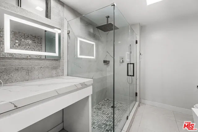a bathroom with a sink and a shower