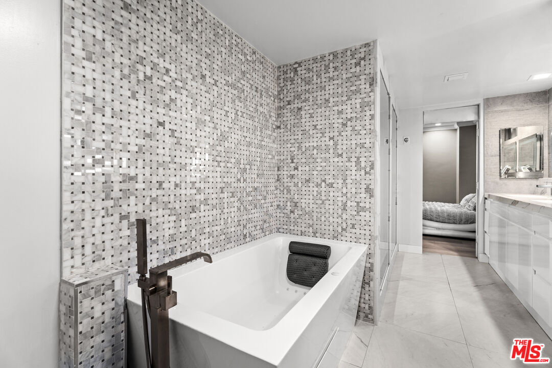 1333 South Beverly Glen Boulevard, Unit 605 Los Angeles, CA 90024 - Photo 18 of 27 a bathroom with a sink a toilet and shower