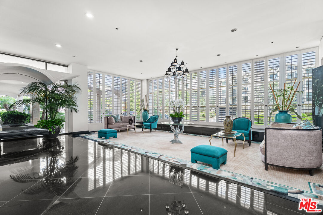 1333 South Beverly Glen Boulevard, Unit 605 Los Angeles, CA 90024 - Photo 26 of 27 a living room with furniture and a large window