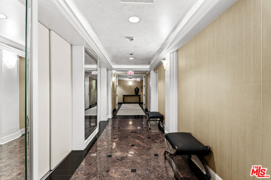 1333 South Beverly Glen Boulevard, Unit 605 Los Angeles, CA 90024 - Photo 27 of 27 a hallway view with wooden floor and furniture