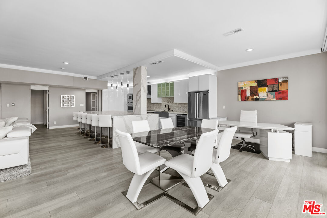 1333 South Beverly Glen Boulevard, Unit 605 Los Angeles, CA 90024 - Photo 8 of 27 a living room with furniture and wooden floor