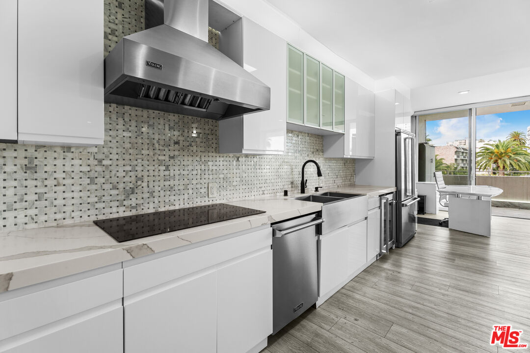 1333 South Beverly Glen Boulevard, Unit 605 Los Angeles, CA 90024 - Photo 10 of 27 a kitchen with a sink and cabinets