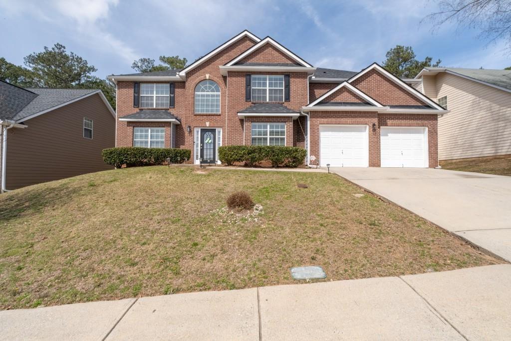 7178 Cavender Drive Southwest Atlanta, GA 30331 - Photo 1 of 47 a front view of a house with yard