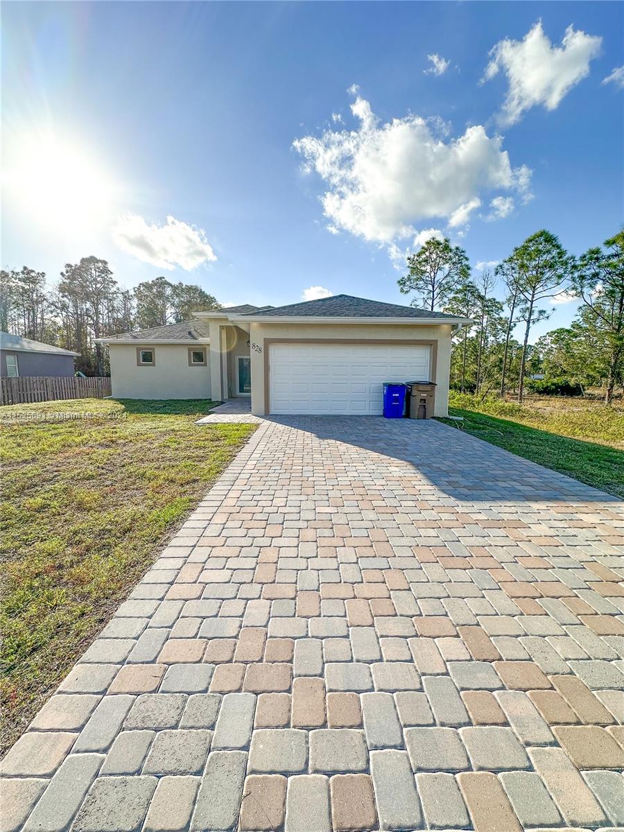 828 Homestead Road South Lehigh Acres, FL 33974 - Photo 1 of 48 a view of swimming pool with an outdoor space and seating area
