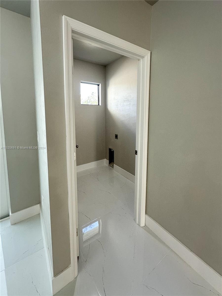 828 Homestead Road South Lehigh Acres, FL 33974 - Photo 12 of 48 a view of a bathroom from a bathroom