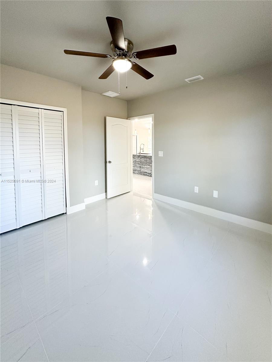 828 Homestead Road South Lehigh Acres, FL 33974 - Photo 14 of 48 a view of an empty room