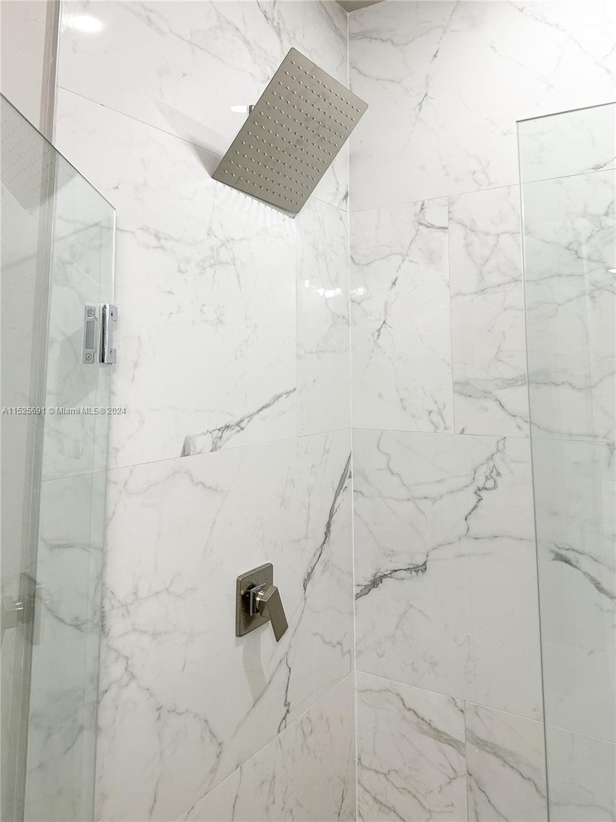 828 Homestead Road South Lehigh Acres, FL 33974 - Photo 17 of 48 a bathroom with a shower
