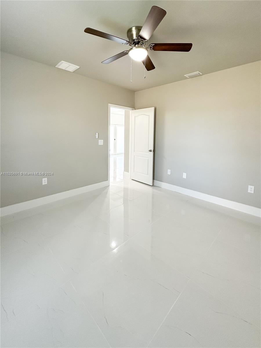 828 Homestead Road South Lehigh Acres, FL 33974 - Photo 20 of 48 a view of an empty room