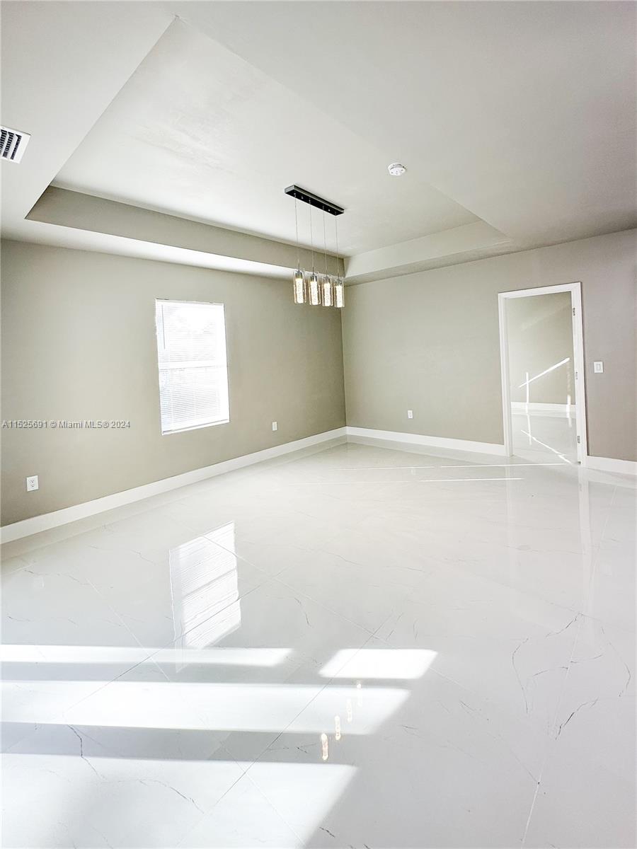 828 Homestead Road South Lehigh Acres, FL 33974 - Photo 22 of 48 a view of an empty room